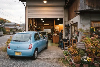整備工場で自動車を点検・整備している様子