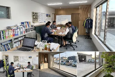 自動車整備工場・販売店の事務所で事務作業をしている様子
